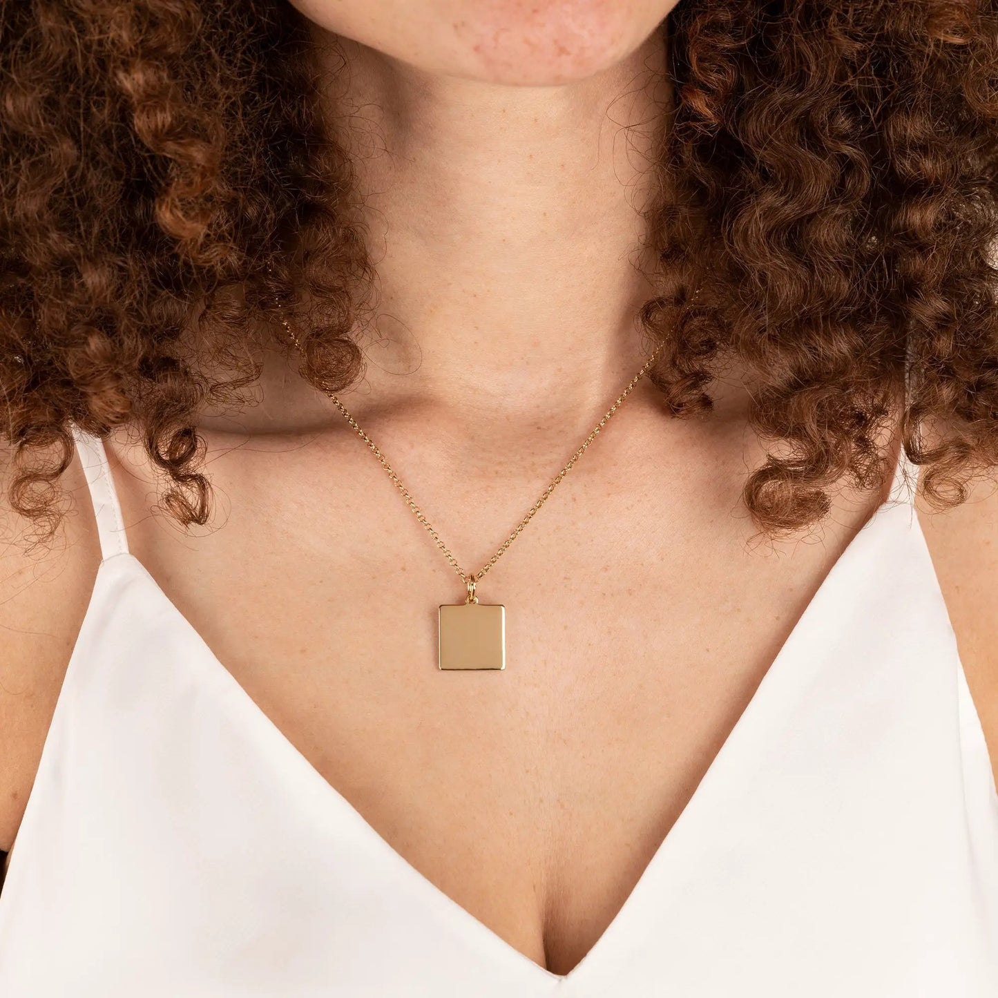 Gold-tone square pendant necklace on a delicate 21in chain on Tampa Home & Garden Store