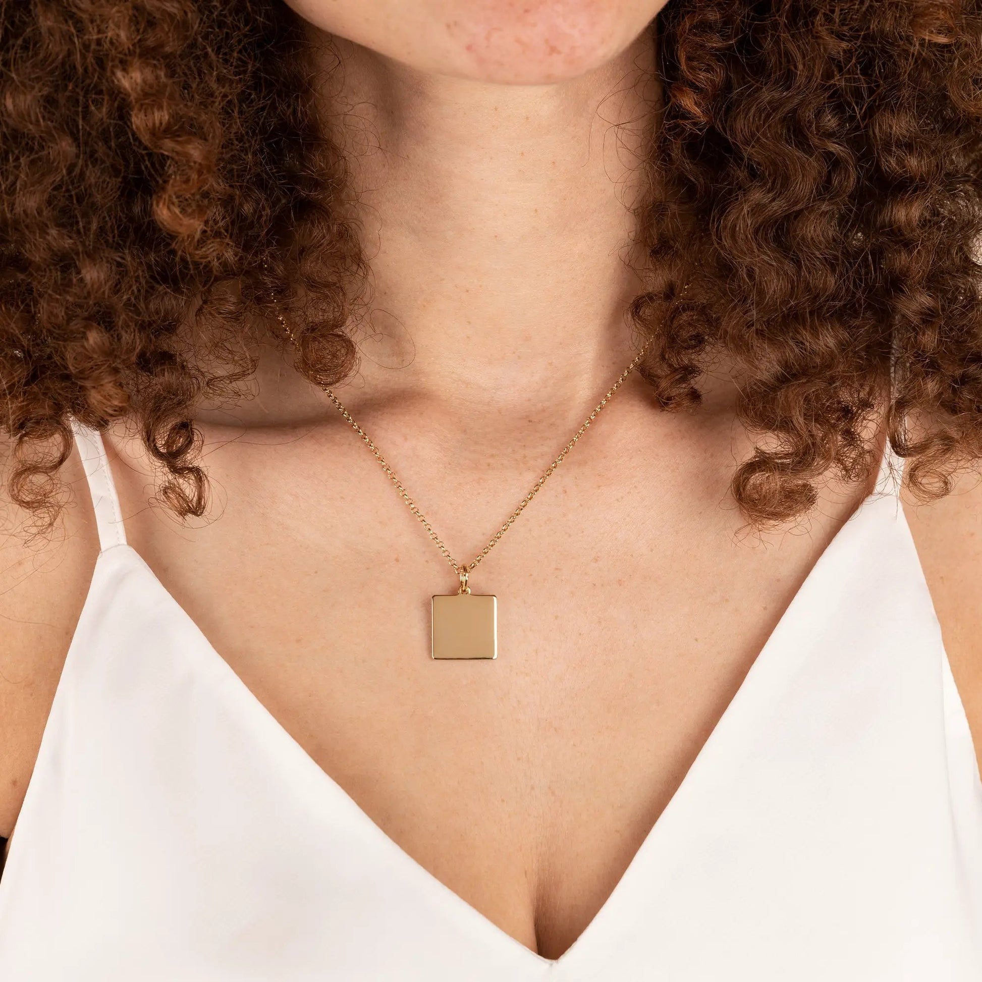 Gold-tone square pendant necklace on a delicate 21in chain on Tampa Home & Garden Store
