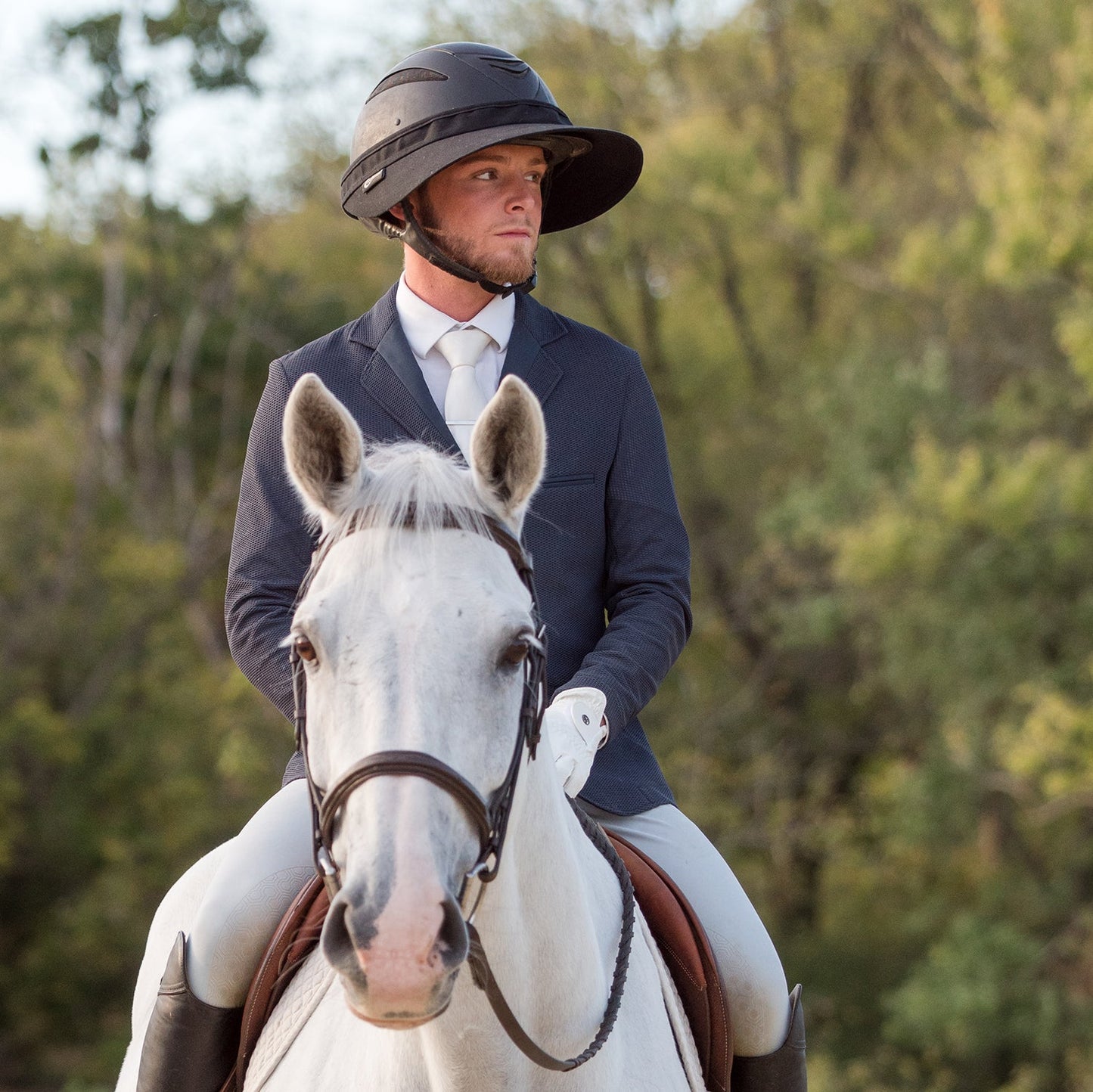 EquiVisor Original Shorty 3-inch sun visor product on rider in dark blazer atop white horse on Tampa Home & Garden Store