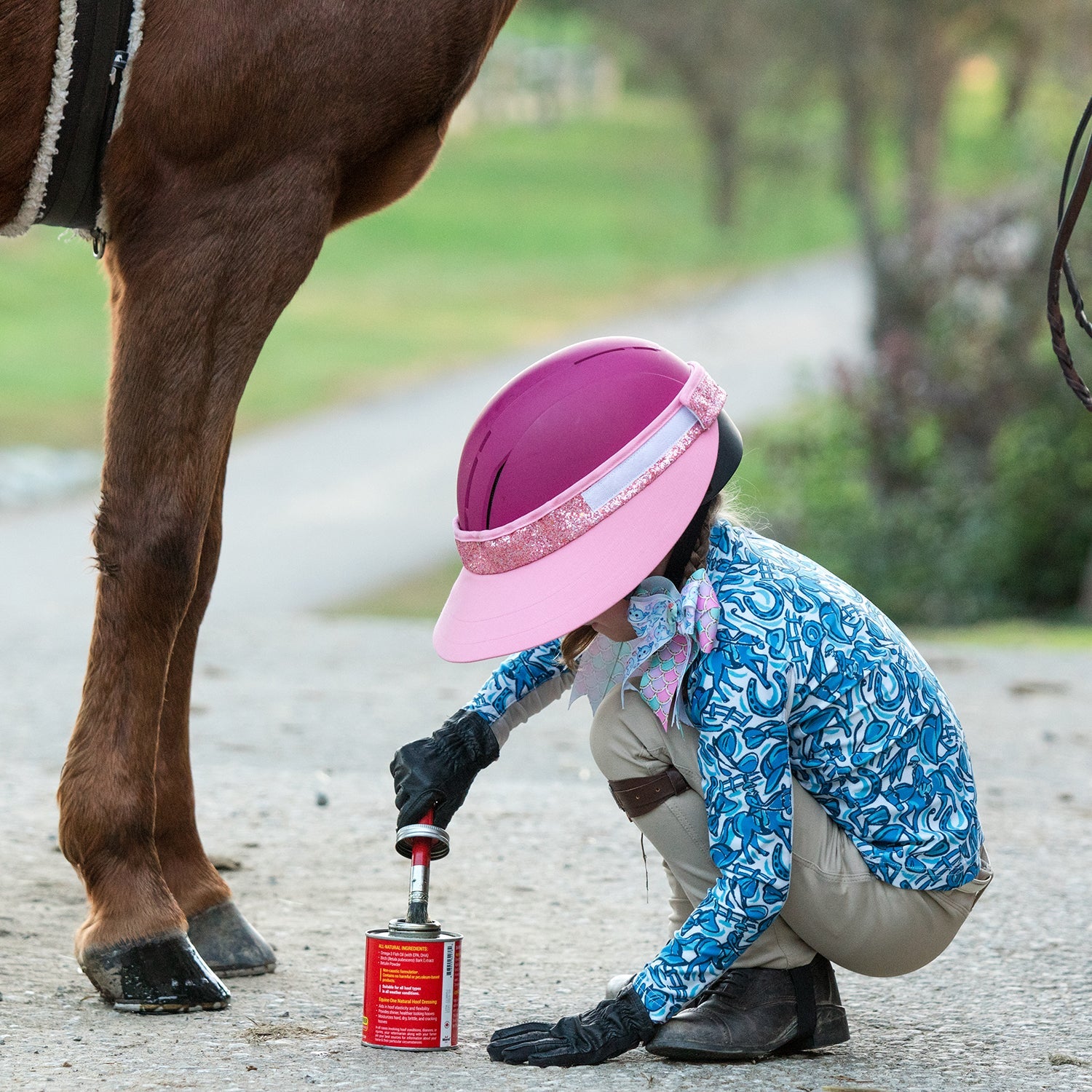 EquiVisor Shorty 3in Glitz pink sun visor with glitter band worn by a rider beside a horse on Tampa Home & Garden Store