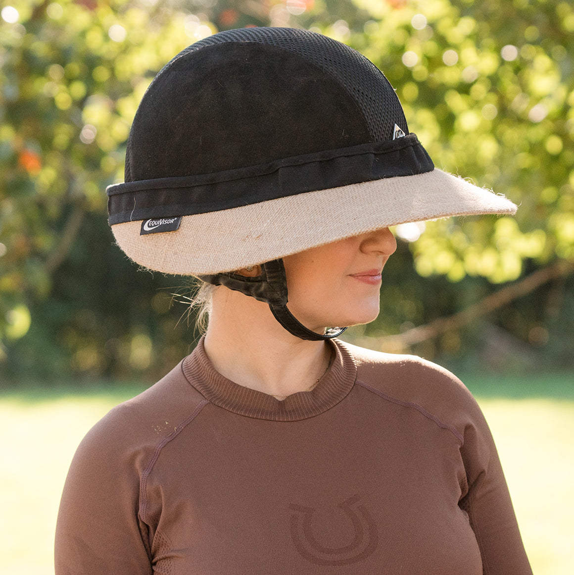 EquiVisor Original Shorty 3 sun visor with beige brim and black crown worn by a model, logo tag on Tampa Home & Garden Store
