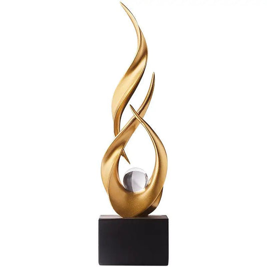 Gold resin water-rising sculpture figurine with clear sphere on black base on Tampa Home & Garden Store