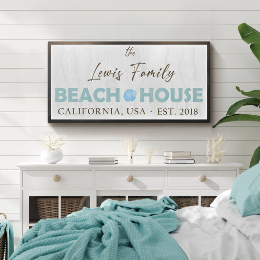 Beach House canvas sign with teal lettering and seashell icon on light linen backdrop on Tampa Home & Garden Store