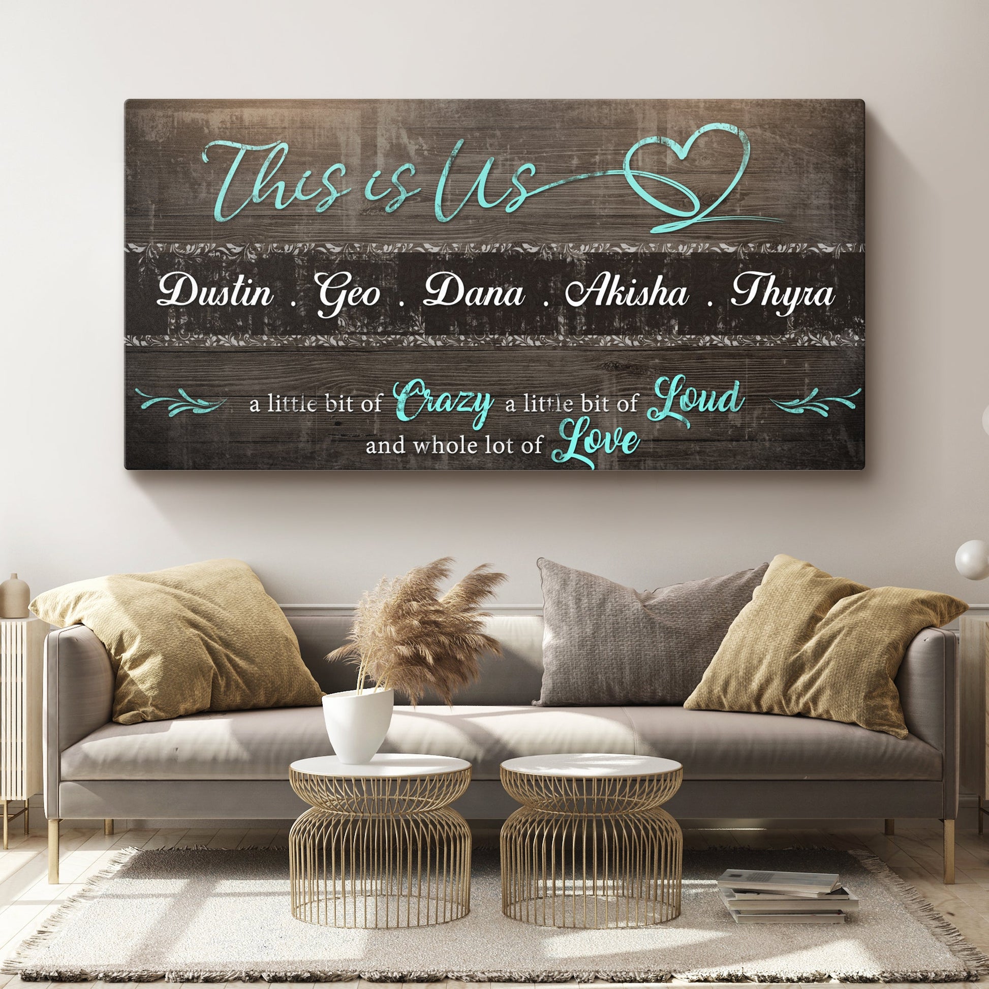 This is Us Family Sign canvas on dark wood with teal script and names Dustin Geo Dana Akisha Thyra on Tampa Home & Garden Store