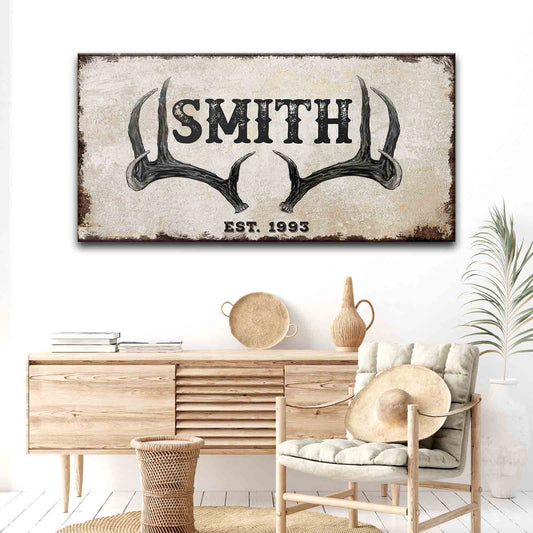 Rustic Family Antler Sign II canvas wall art with distress beige background and black SMITH text on Tampa Home & Garden Store