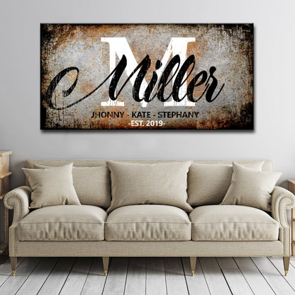 Family Last Name Sign canvas with rustic texture, white M over black Miller script on Tampa Home & Garden Store