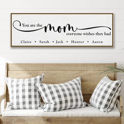Canvas sign by Tailored Canvases, black script on white with brown frame, mom quote on Tampa Home & Garden Store