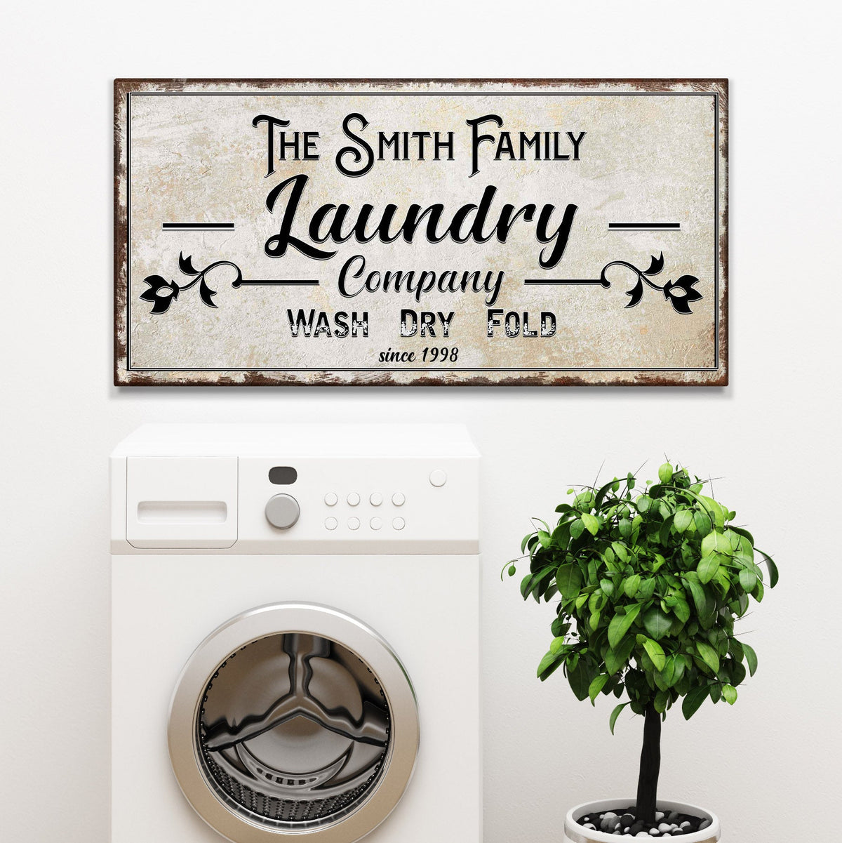 Family Laundry Company sign canvas with distressed rustic frame and black script typography on Tampa Home & Garden Store