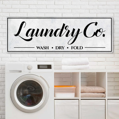 Laundry Co. canvas sign by Tailored Canvases with black frame and script WASH • DRY • FOLD on Tampa Home & Garden Store