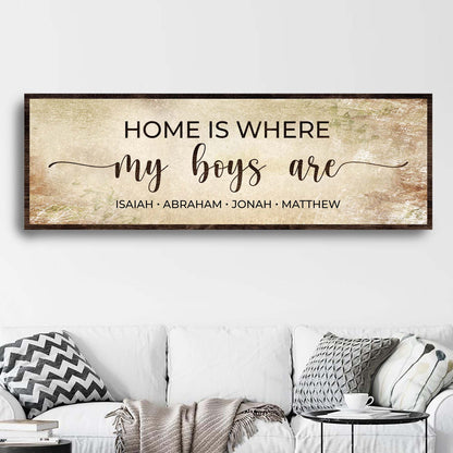 Wood-framed canvas sign with beige vintage backdrop reading Home Is Where My Boys Are on Tampa Home & Garden Store