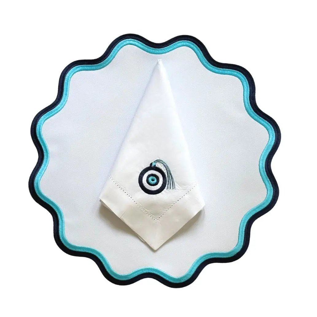 Mykonos placemat with turquoise blue scalloped edge trim, white center by Talah Home for coastal tables on Tampa Home & Garden Store