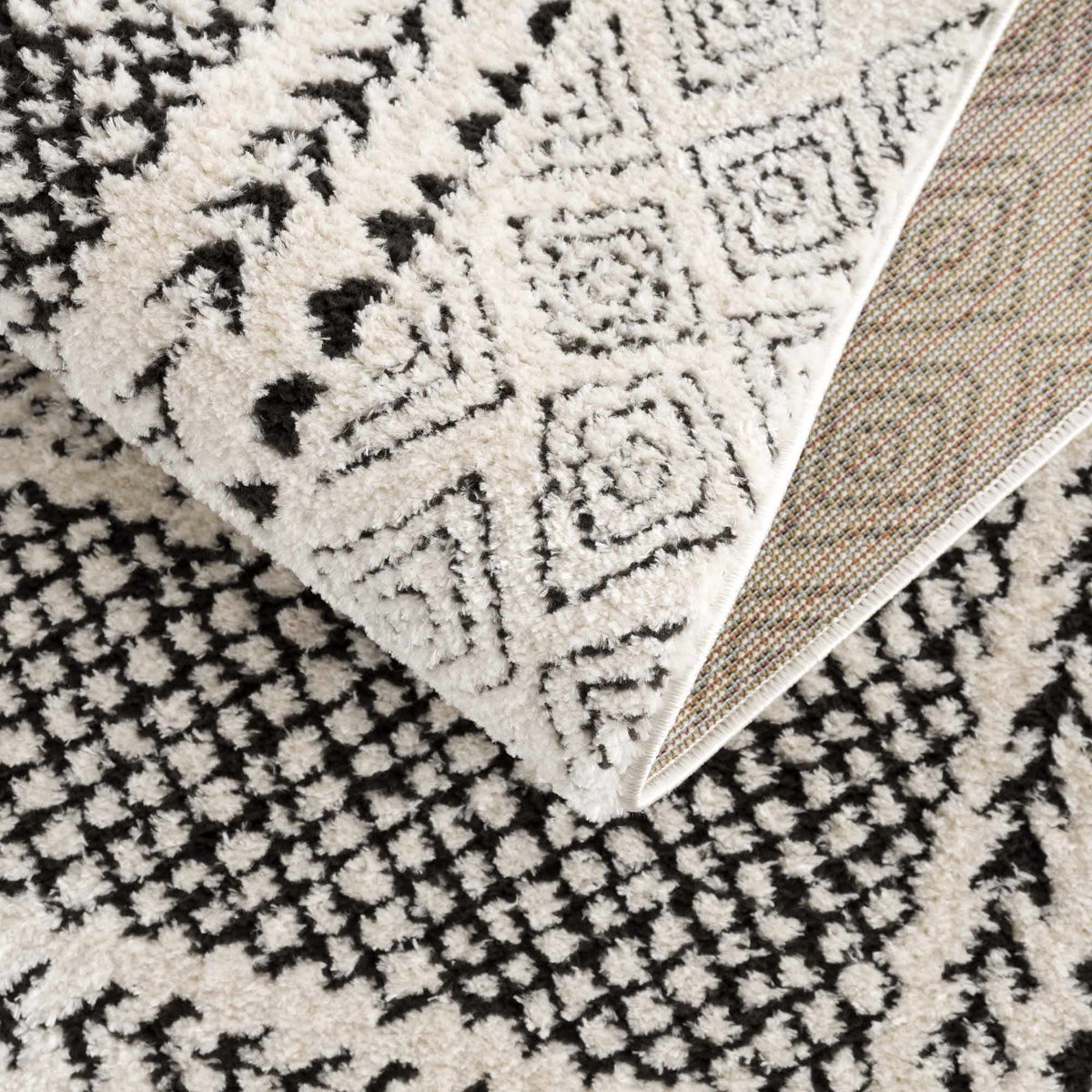 Julio Area Rug by Boutique Rugs in ivory and black geometric pattern on Tampa Home & Garden Store