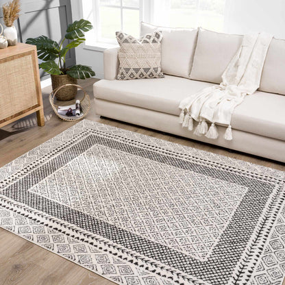 Julio Area Rug by Boutique Rugs, black and white geometric rug in a bright living room on Tampa Home & Garden Store