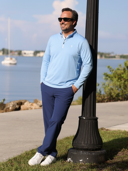 Freeport Pant Versatile Performance navy pants by White Water Life, man in light blue top on Tampa Home & Garden Store