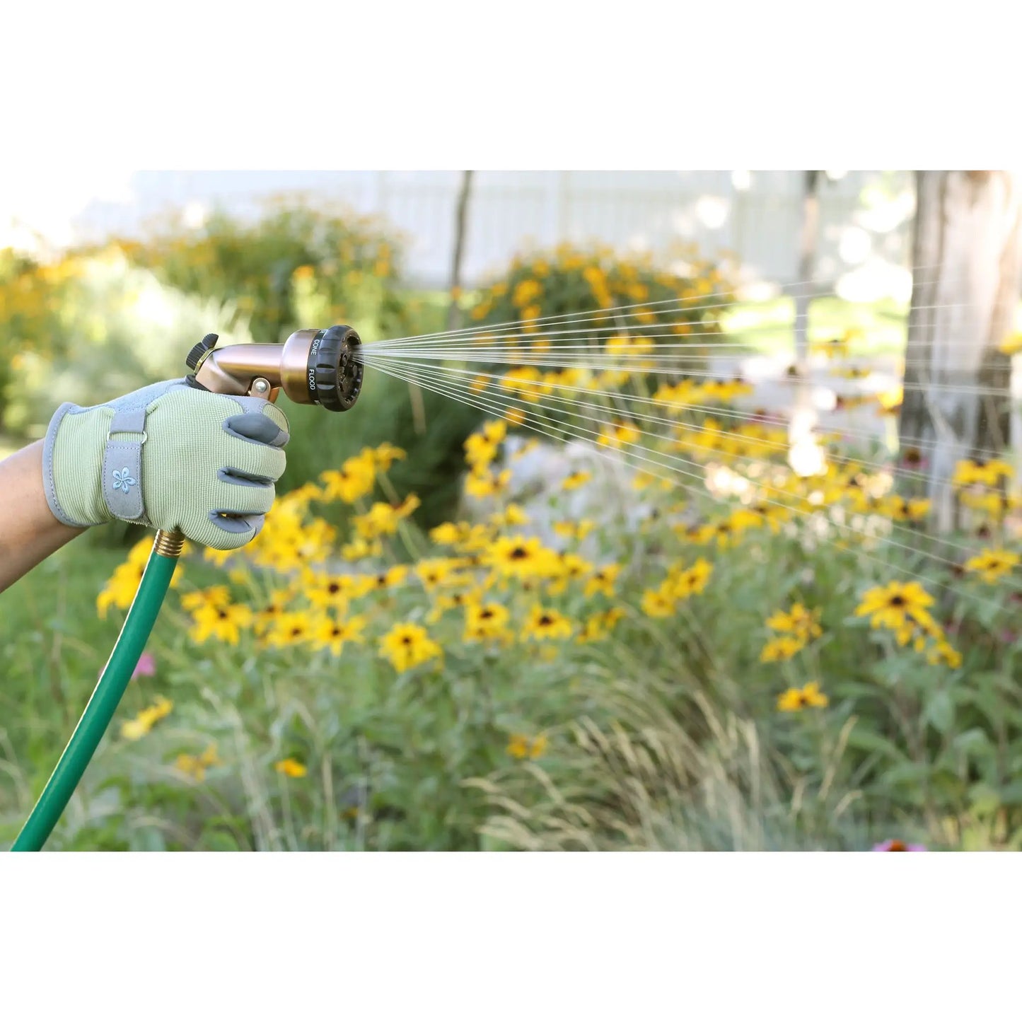 7-Pattern Zinc Front Trigger Nozzle Copper Orbit Irrigation gloved hand watering lawn on Tampa Home & Garden Store
