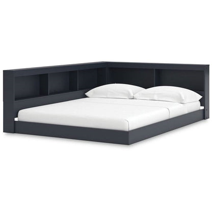 Cama de esquina de madera azul de tamaño completo con cabecero con estantería y puertos USB
