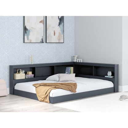 Cama de esquina de madera azul de tamaño completo con cabecero con estantería y puertos USB