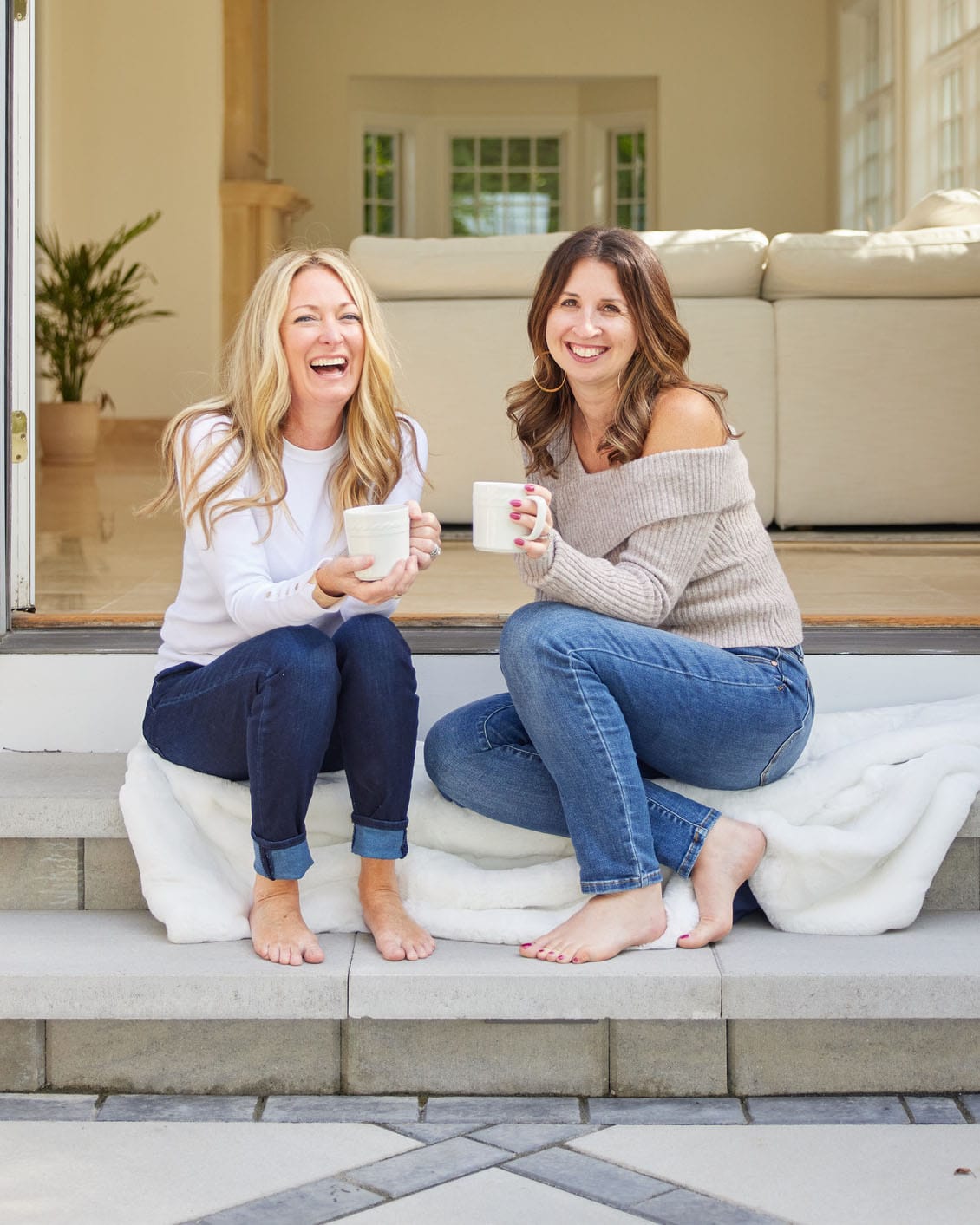 Rosé All Day on White Lap Blanket two women sit on outdoor steps, holding mugs on Tampa Home & Garden Store