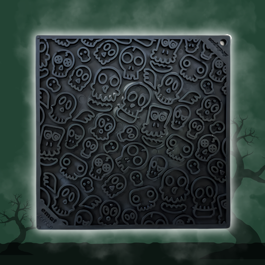 Dog Lick Mat by Farm To Pet, dark gray silicone slow feeder with embossed skull shapes on Tampa Home & Garden Store