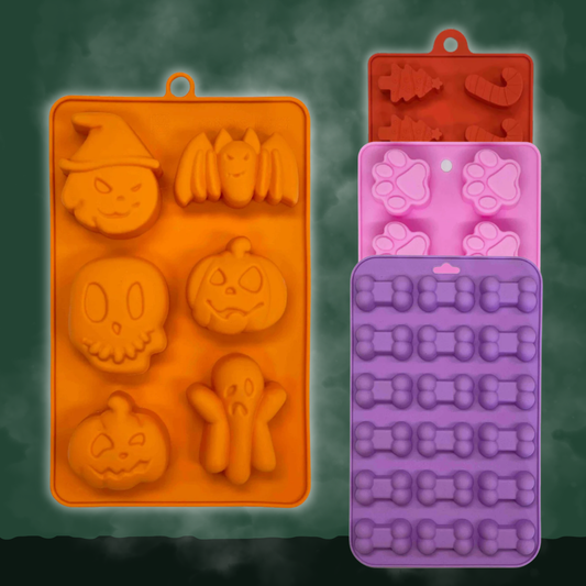 Pet Treat Molds silicone set by Farm To Pet in orange Halloween shapes and pink paw/bone molds on Tampa Home & Garden Store