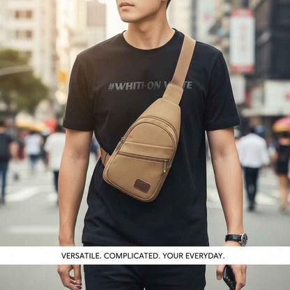 Canvas Sling Bag by Shaketea in tan canvas with front zip pocket and crossbody strap on Tampa Home & Garden Store