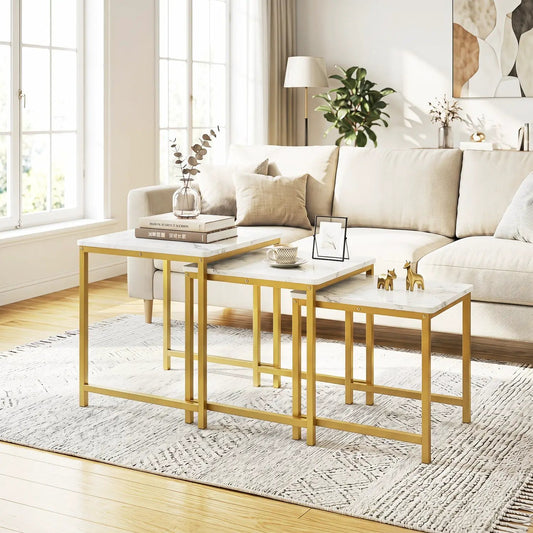 Nesting tables set of 3 with faux marble tops and gold metal frames beside a beige sofa on Tampa Home & Garden Store