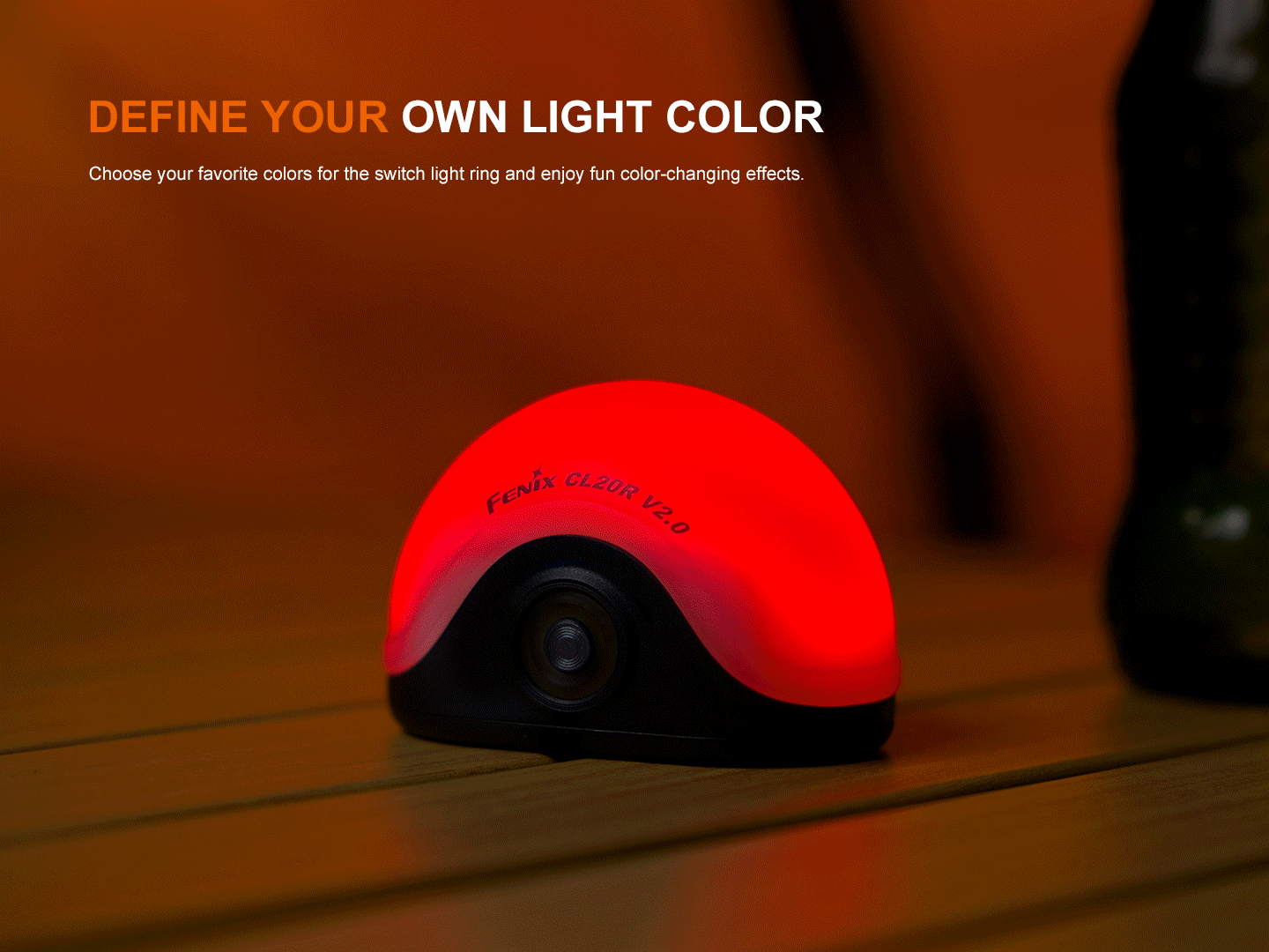 Lantern Fenix CL20R V2 multicolor camping lantern glowing red on wood table on Tampa Home & Garden Store