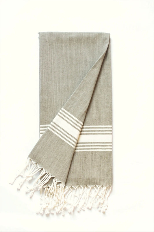 Figueres olive green and white beach towel with striped border and fringe on Tampa Home & Garden Store