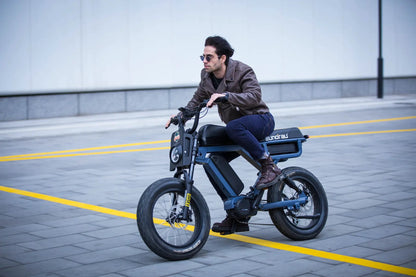 FLASH LITE 2.0 electric bike blue frame rider wearing brown leather jacket by EUNORAU E-BIKE US on Tampa Home & Garden Store