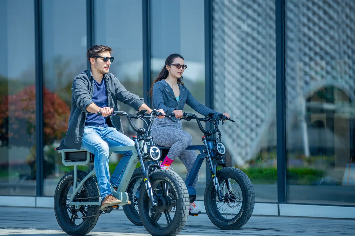 FLASH LITE 2.0 electric bike by EUNORAU E-BIKE US with two riders on gray fat-tire bikes on Tampa Home & Garden Store
