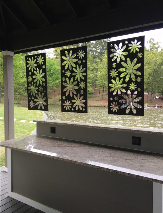 Metal privacy screens, four black panels with gold floral cutouts for outdoor decor on Tampa Home & Garden Store