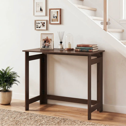 DirectDeals folding console table in dark wood finish with space-saving design, framed photos and books on Tampa Home & Garden Store