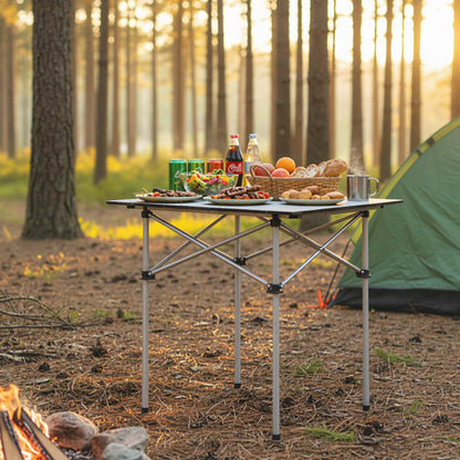 GemGear Folding Roll-up Camping Table with Metal Legs at forest campsite with bread basket on Tampa Home & Garden Store