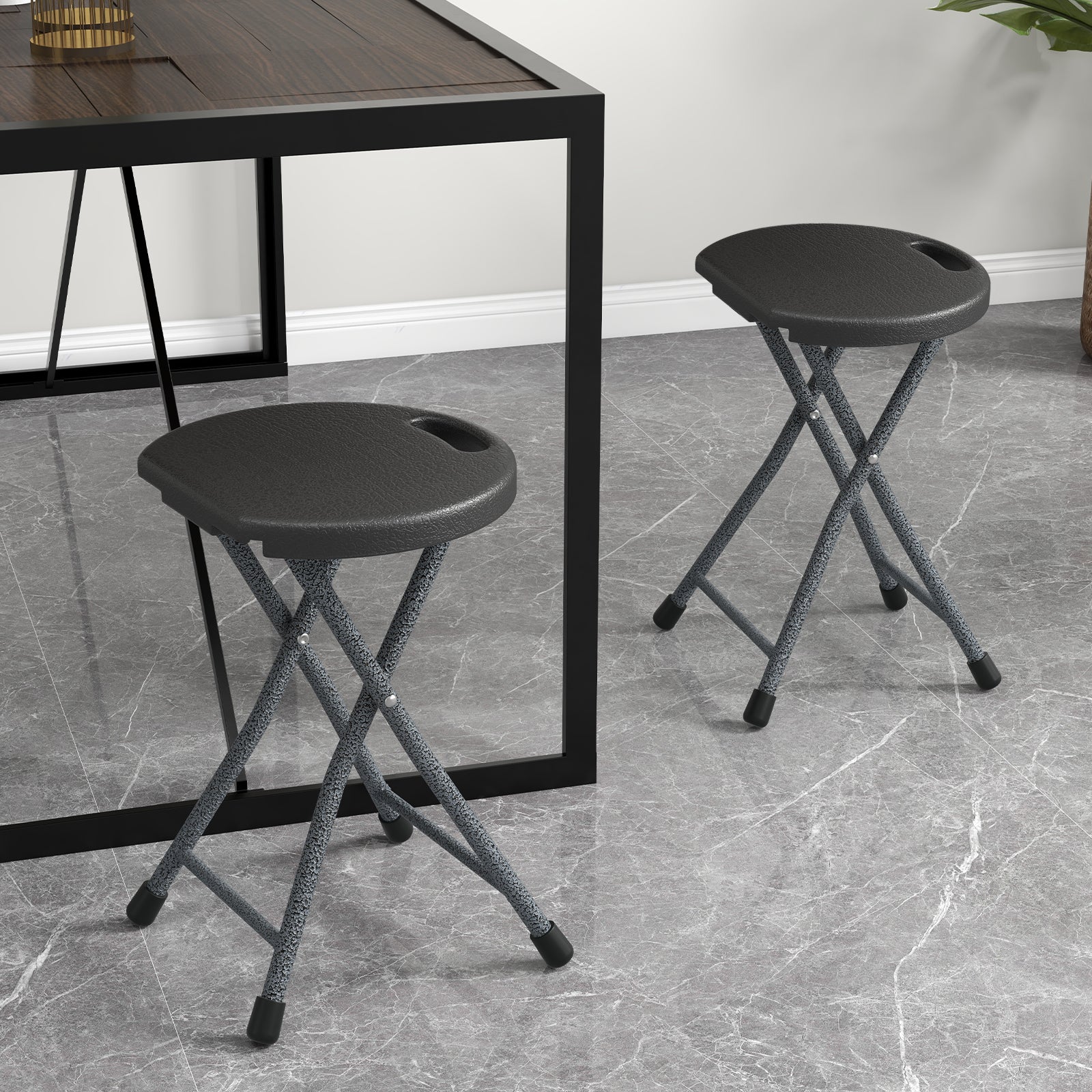 GemGear folding stool with built-in handle, gray speckled legs, black round seat, 2 shown on Tampa Home & Garden Store