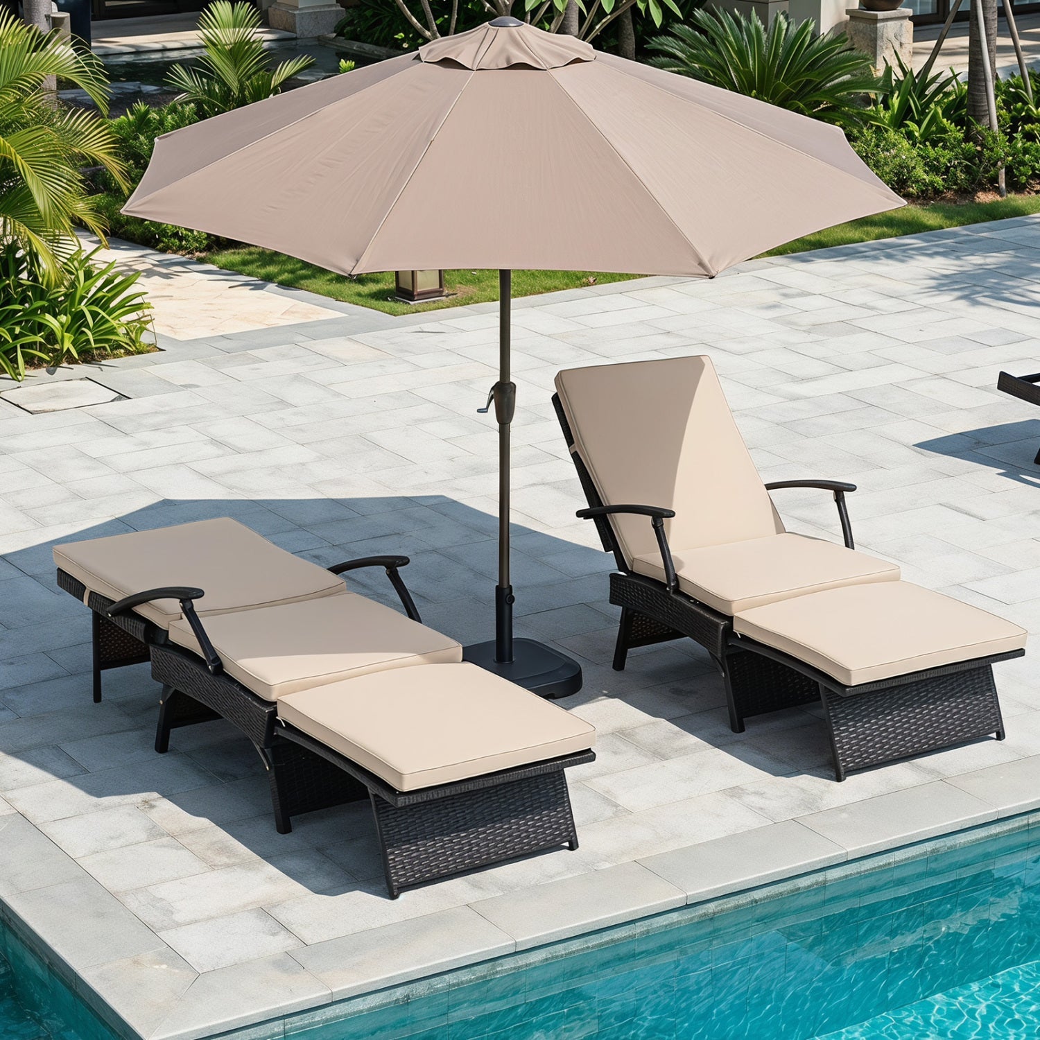 Two folding wicker chaise lounges with beige cushions under a tan umbrella on Tampa Home & Garden Store