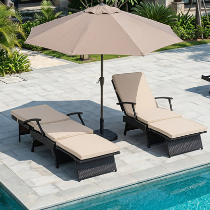Two folding wicker chaise lounges with beige cushions under a tan umbrella on Tampa Home & Garden Store