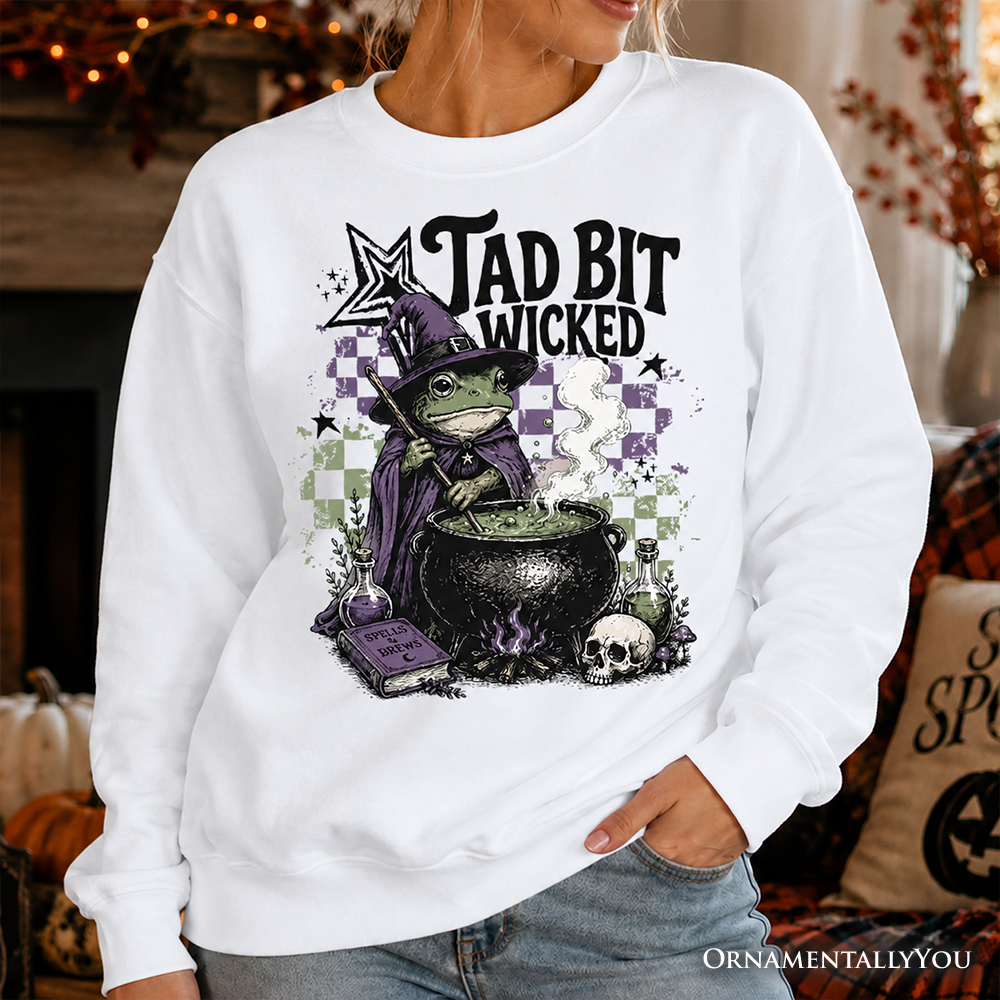 Tad Bit Wicked Frog Witch Sweatshirt in white with purple cauldron by OrnamentallyYou on Tampa Home & Garden Store