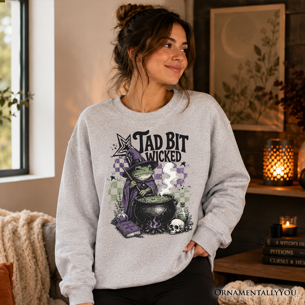 Tad Bit Wicked Frog Witch Sweatshirt gray with purple hat frog and cauldron OrnamentallyYou on Tampa Home & Garden Store
