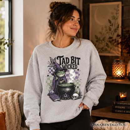 Tad Bit Wicked Frog Witch Sweatshirt gray with purple hat frog and cauldron OrnamentallyYou on Tampa Home & Garden Store