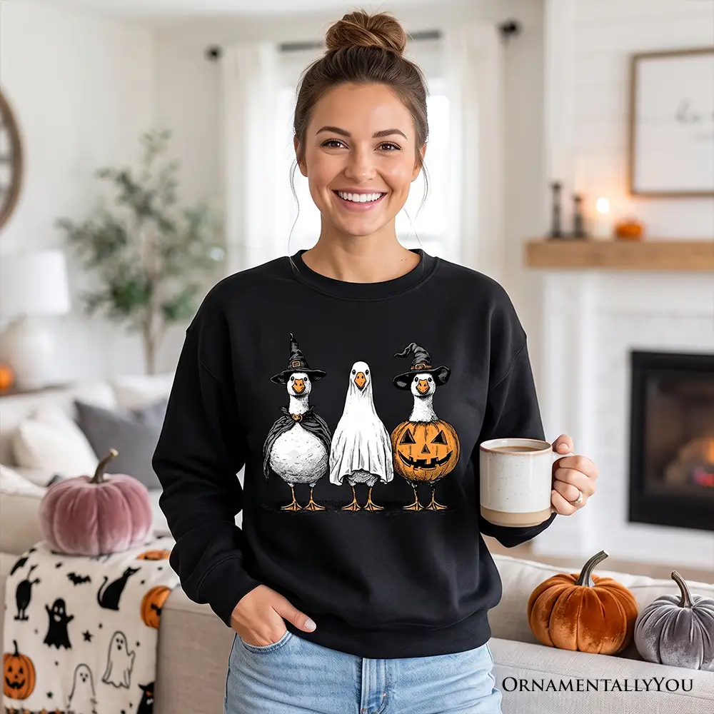 Haunting Honkers Goose Sweatshirt in black with Halloween goose trio OrnamentallyYou on Tampa Home & Garden Store