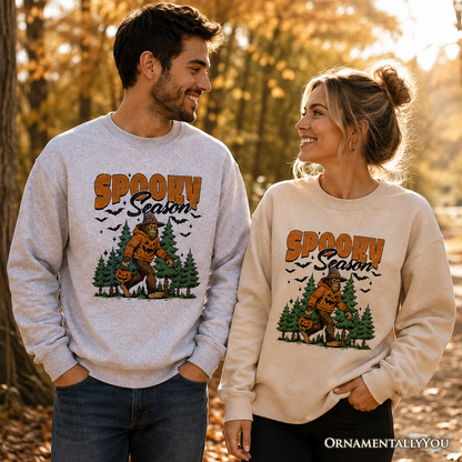 Two Spooky Season Bigfoot Sweatshirts gray and beige with pumpkin Sasquatch OrnamentallyYou on Tampa Home & Garden Store