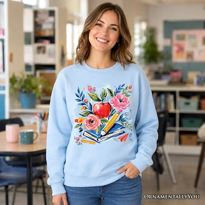 Boho Floral Teacher Sweatshirt in light blue with watercolor apple and books by OrnamentallyYou on Tampa Home & Garden Store