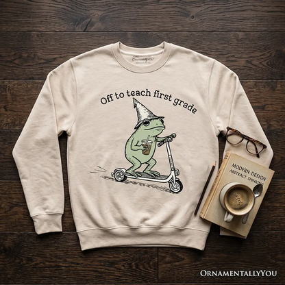 Off to Teach First Grade Frog Sweatshirt beige with a green frog on a scooter, OrnamentallyYou on Tampa Home & Garden Store