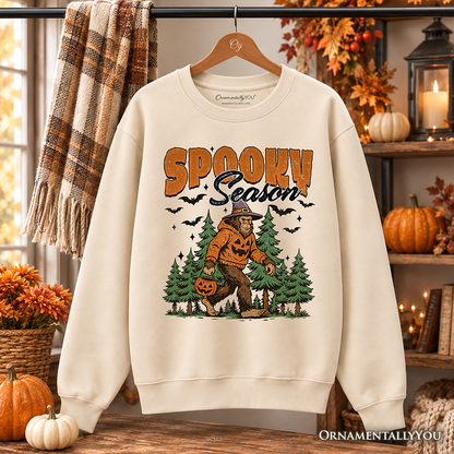 Spooky Season Bigfoot Sweatshirt orange SPOOKY text pumpkin Sasquatch among trees OrnamentallyYou on Tampa Home & Garden Store