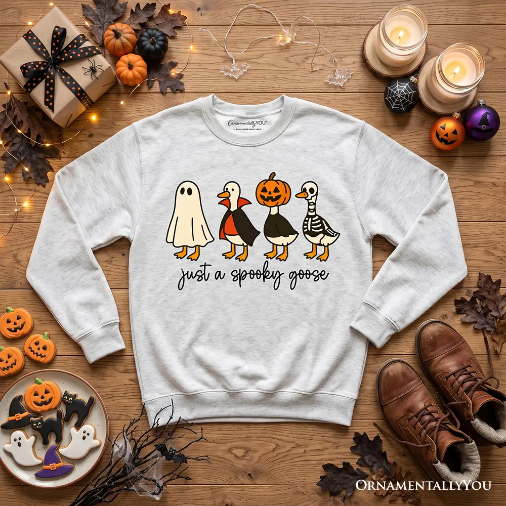 Just a Spooky Goose Sweatshirt in light gray with four Halloween-geese costumes OrnamentallyYou on Tampa Home & Garden Store