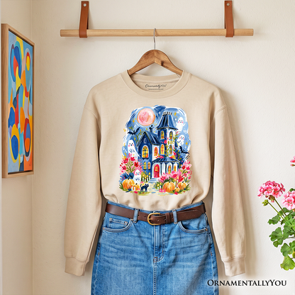 Watercolor Haunted House Sweatshirt beige with ghost and pumpkin artwork by OrnamentallyYou on Tampa Home & Garden Store