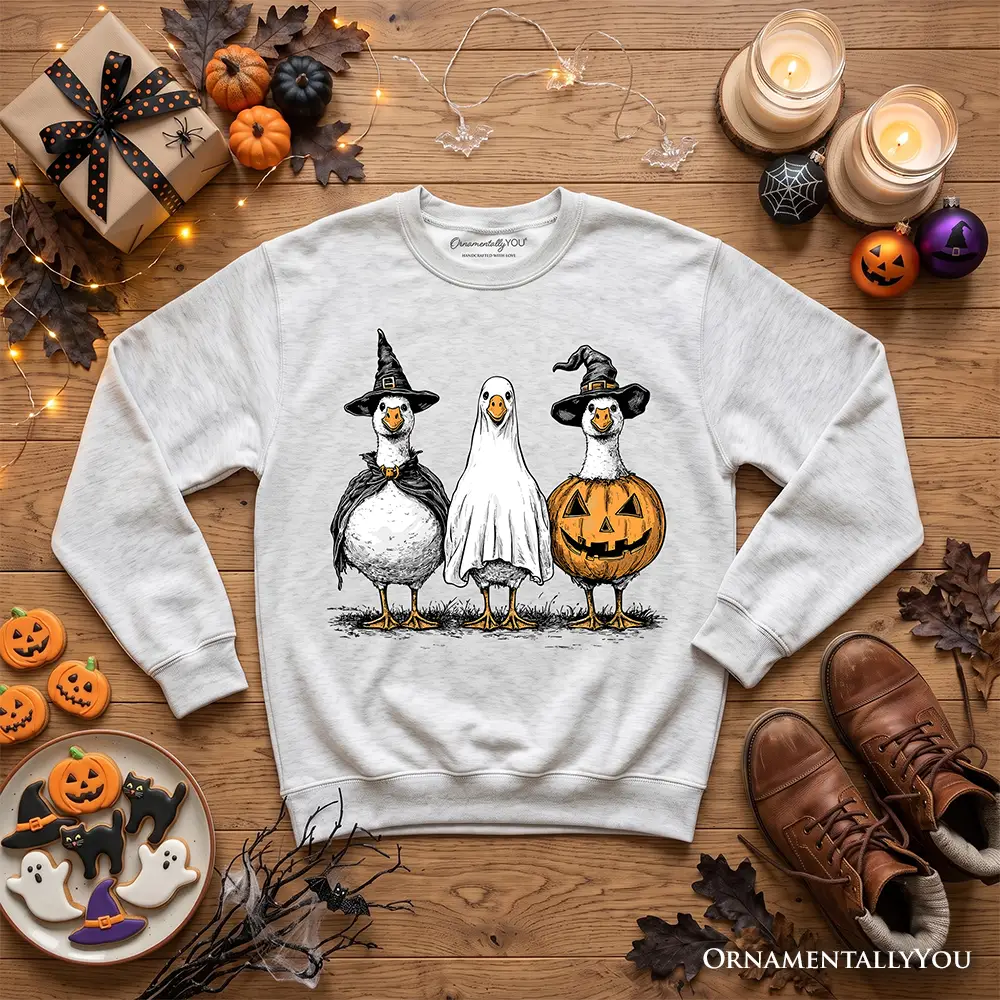 Haunting Honkers Goose Sweatshirt in gray with geese in witch, ghost, pumpkin costumes OrnamentallyYou on Tampa Home & Garden Store