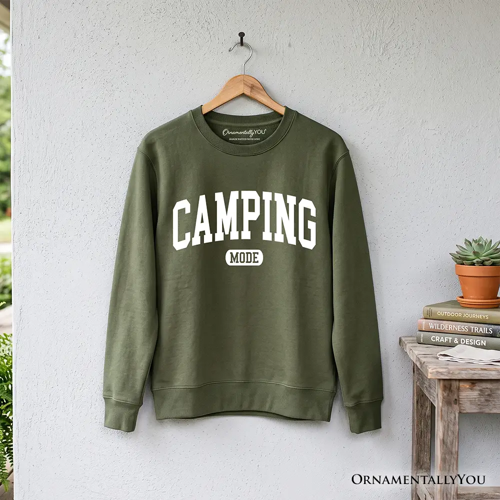 Camping Mode varsity sweatshirt in olive with white print on wooden hanger by OrnamentallyYou on Tampa Home & Garden Store
