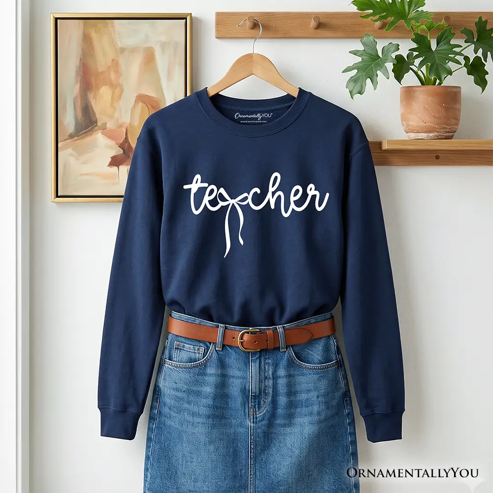 Teacher Coquette Bow Sweatshirt in navy with white script OrnamentallyYou paired with denim on Tampa Home & Garden Store