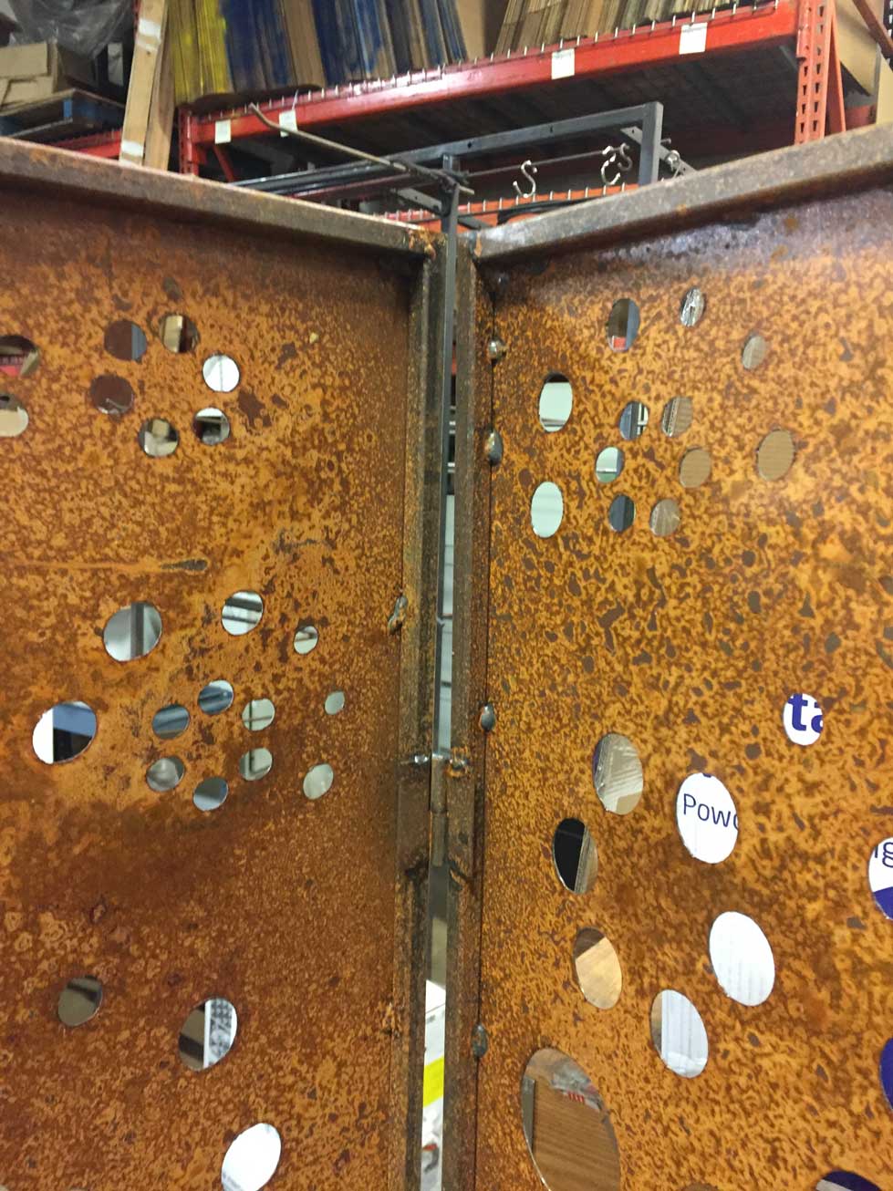 Two rusted metal outdoor privacy screens with round cutouts, 46-inch Rustica Ornamentals on Tampa Home & Garden Store